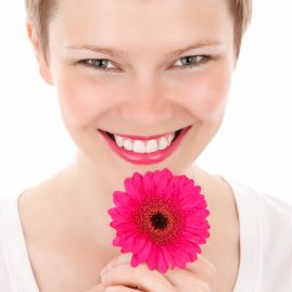 smiling_woman_with_a_flower